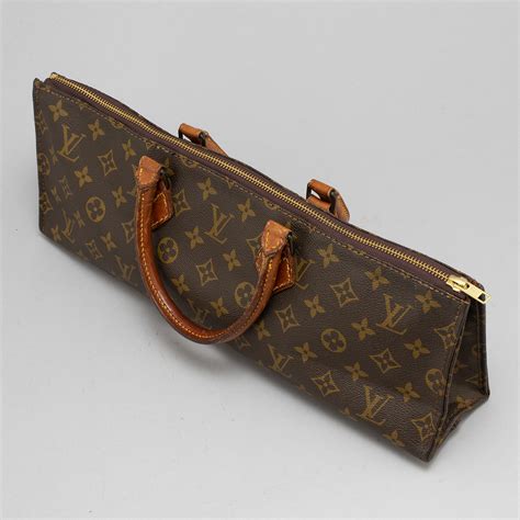 louis vuitton triangle bag.